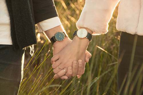 holding hands woman and man hand holding watch